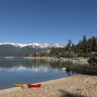 tahoe beach with mountains in background