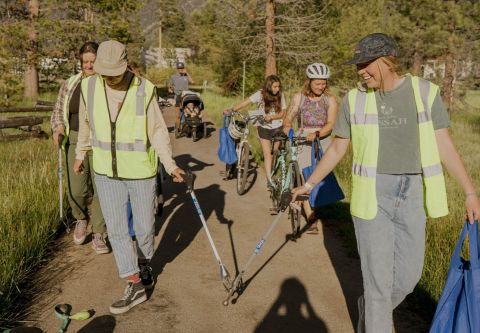 Volunteers picking up trash around the bike path. 