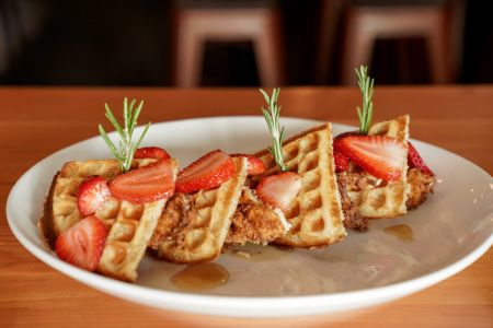 Crosby's Tavern, Fried Chicken & Waffles with 2 Eggs, House Made Maple Bourbon Syrup, Rosemary